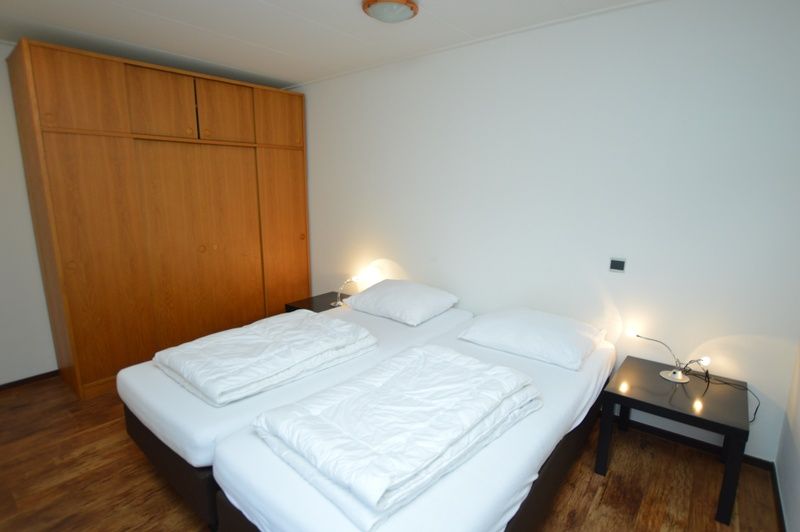 Bedroom in vacation home Orchismient 28 De Koog Texel with double bed.