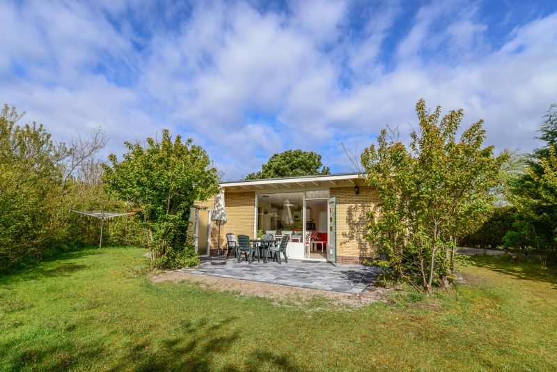 Sunny terrace at Bungalow 51, Bungalowpark 't Luwe Land, De Koog, Texel, ideal for outdoor relaxation.
