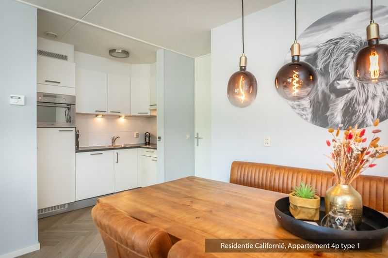 Stylish kitchen in Type 1 vacation home, De Koog, Texel with dining area and atmospheric lighting.