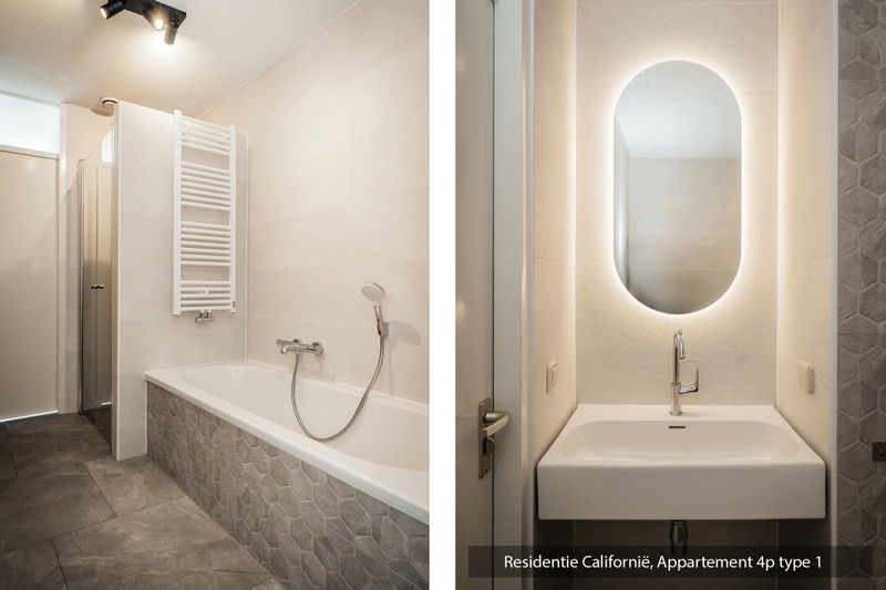 Stylish bathroom in Type 1 vacation home, De Koog, Texel with sink and mood lighting.
