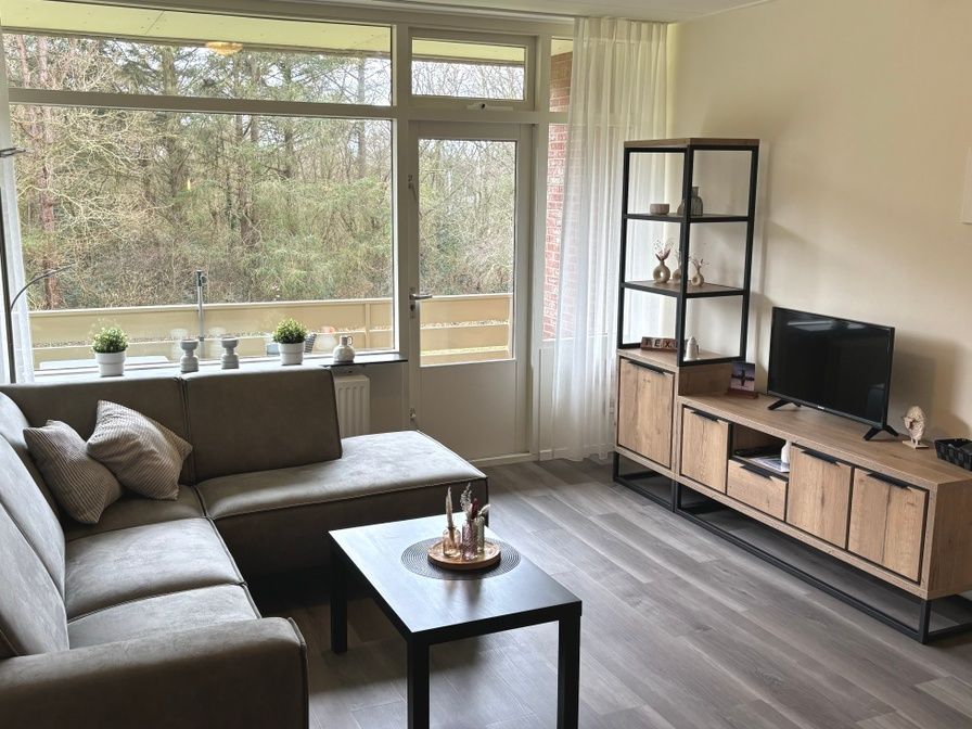 Cozy living room in Apartment Kerckeland 40, De Koog, Texel with a view of nature.