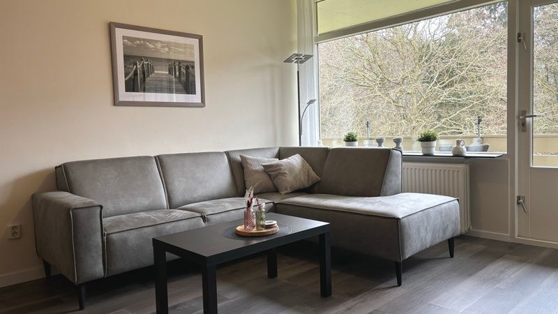 Comfortable sitting area in Apartment Kerckeland 40, De Koog, Texel with green surroundings.