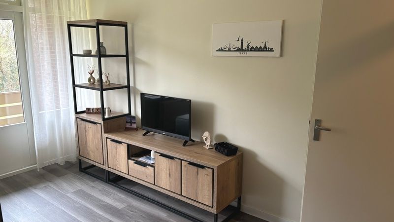 Modern TV corner in Apartment Kerckeland 40, De Koog, Texel for relaxation.