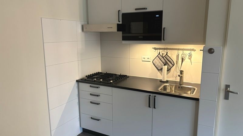 Compact kitchen facilities in Apartment Kerckeland 40, De Koog, Texel for convenience.