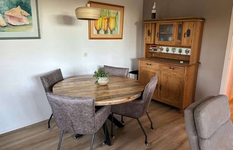 Stylish living room of Cottage in De Koog, Texel, with comfortable seating area and flat-screen TV.