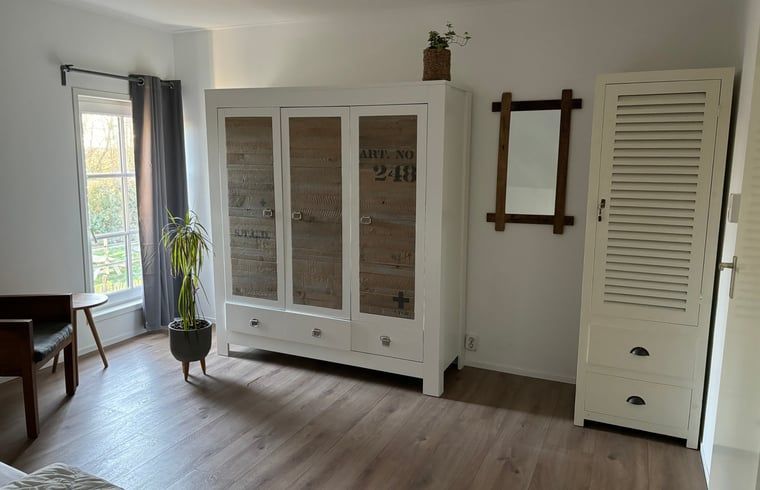 Spacious bedroom with comfortable beds in Cottage in De Koog, Texel, perfect for a good night's sleep.