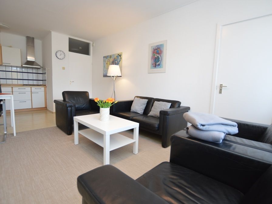 Cozy living room in Apartment Kerckeland 98, De Koog, Texel with comfortable seating and modern furnishings.
