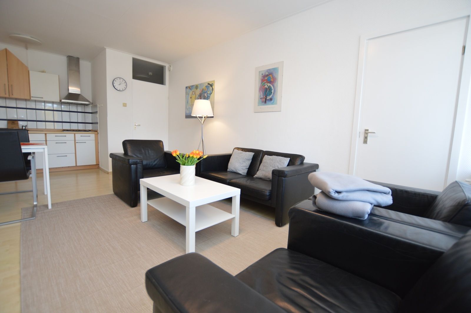 Open living room of Apartment Kerckeland 98, De Koog, Texel with stylish furnishings and lots of natural light.