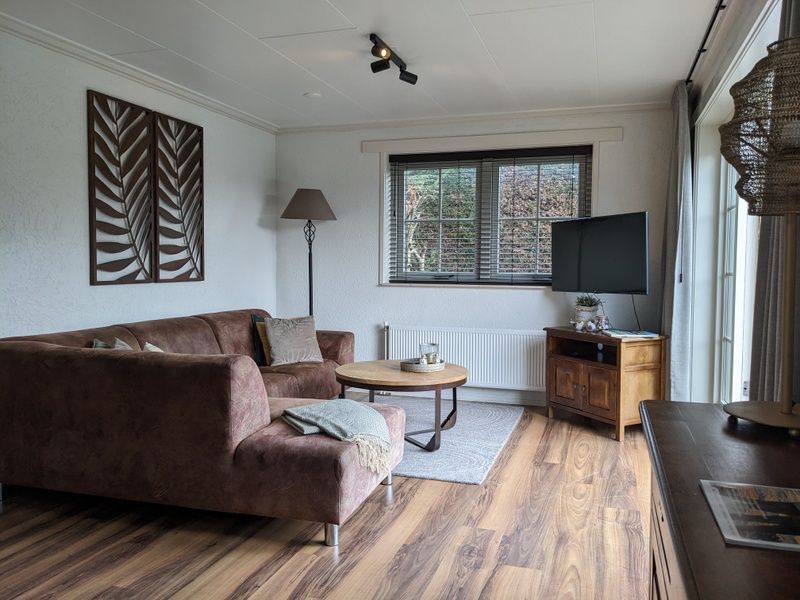 Cozy living room in D' Duinster vacation home, De Koog, Texel with comfortable seating area on the Wadden Islands.