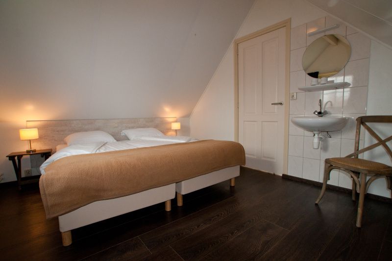 Comfortable bedroom in D' Duinster vacation home, De Koog, Texel with double bed on the Wadden Islands.