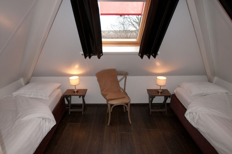 Cozy attic room in D' Duinster vacation home, De Koog, Texel with two single beds on the Wadden Islands.