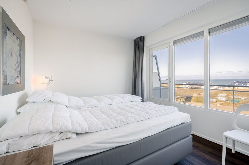 Bedroom in Apartment Juliana 154 Zeezicht, De Koog, Texel with comfortable bed and beautiful sea view.