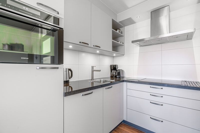 View from Apartment Juliana 154 Zeezicht in De Koog, Texel with vast dunes and the sea on the horizon.