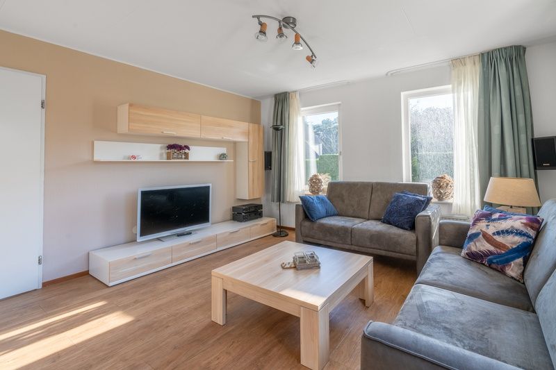 Moderne Sitzecke im Ferienhaus Honeysuckle 97, De Koog, Texel, ideal fuer einen entspannten Aufenthalt auf den Watteninseln.