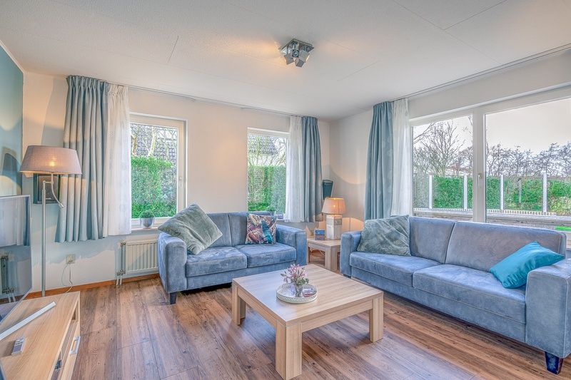 Cozy living room of Holiday home Kamperfoelie 55 in De Koog Texel with modern furnishings.