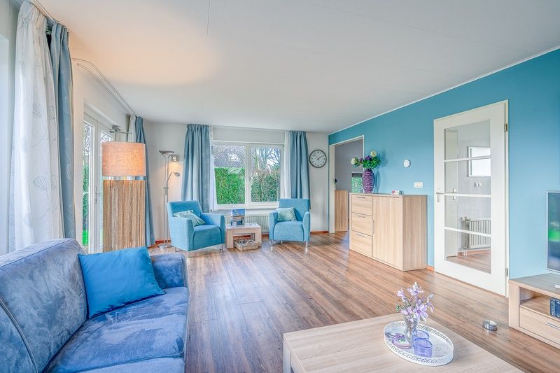 Spacious living room in Holiday home Honeysuckle 55 on Texel, perfect for relaxation.