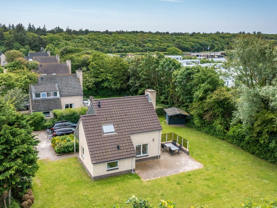 Aerial view of Holiday home Honeysuckle 45 in De Koog, Texel, surrounded by greenery and tranquility.