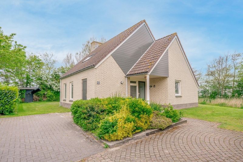 Front view of Holiday Home Honeysuckle 45 in De Koog, Texel, showing an inviting entrance.