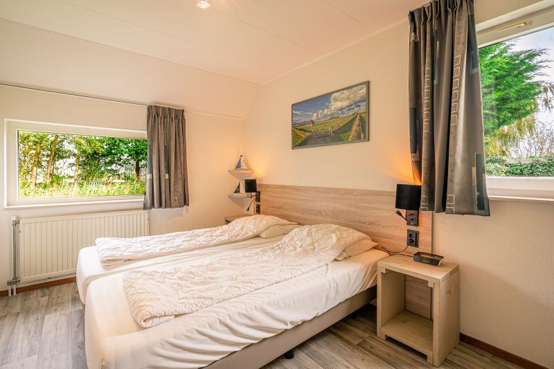 Attic room with two beds in Holiday Home Honeysuckle 45, De Koog, Texel, with skylight.