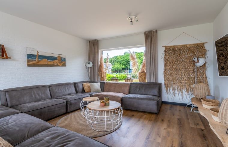 Comfortable sitting area in Cottage in De Koog, Texel, with garden view, Wadden Islands.