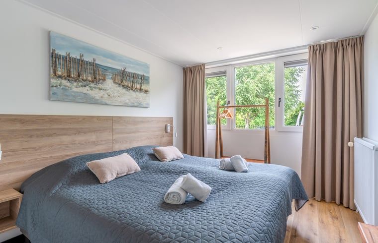 Bedroom with large window in Cottage in De Koog, De Koog, Texel, Wadden Islands.