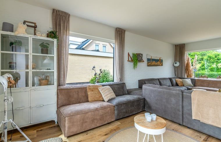 Cozy sitting area in Cottage in De Koog, Texel, overlooking garden, Wadden Islands.