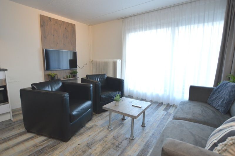 Modern sitting area with television in Motel Texel - Apartment 211/1P, De Koog, Texel.