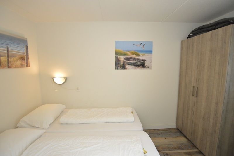 Bedroom with double beds in Motel Texel - Apartment 211/1P, De Koog, Texel, for a good night's sleep.