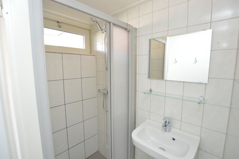 Fresh bathroom with shower in Motel Texel - Apartment 211/1P, De Koog, Texel, for a refreshing start to the day.