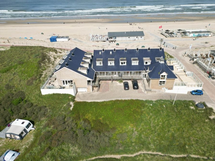 Aerial photo of Resort De Buteriggel Apartment 1, located on the beach in De Koog, Texel, Wadden Islands.