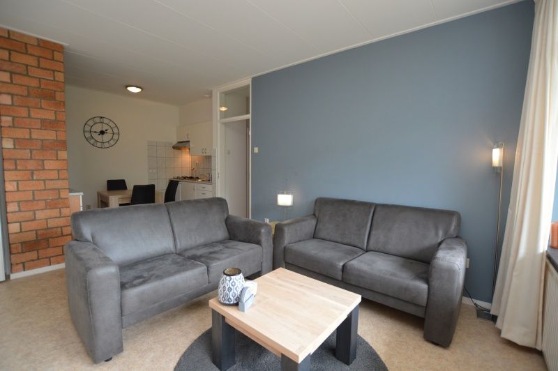 Cozy sitting area in Apartment Kerckeland 122, De Koog, Texel with stylish furniture.