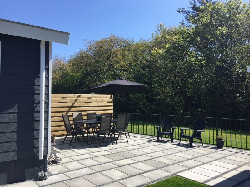 Spacious terrace with seating at Chalet Bregkoog 224, De Koog, Texel.