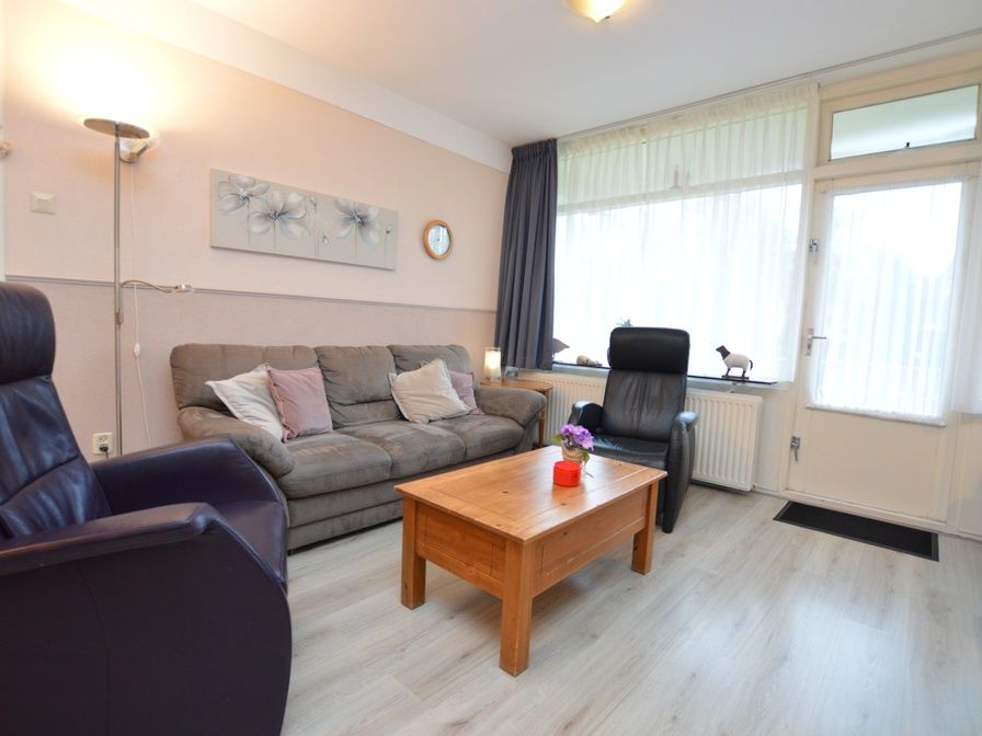 Cozy living room of Apartment Kerckeland 70 in De Koog, Texel with comfortable seating area.