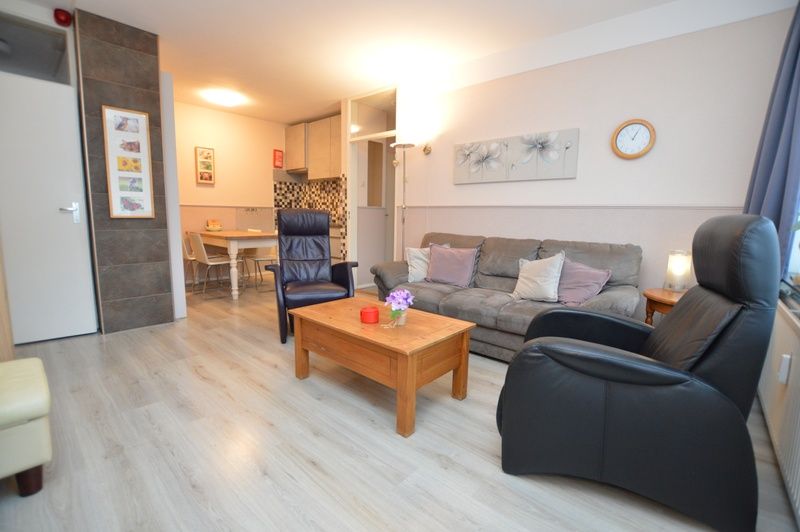 Spacious interior of Apartment Kerckeland 70, vacation accommodation in De Koog, Texel with open kitchen.