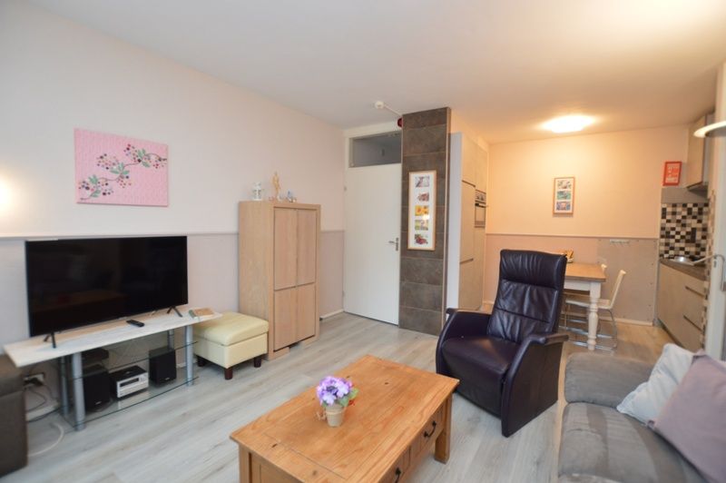 Modern dining and sitting area in Apartment Kerckeland 70, vacation accommodation in De Koog, Texel.