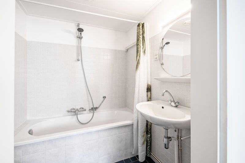 Modern bathroom with shower and sink in Two persons apartment large - first floor, De Koog, Texel.