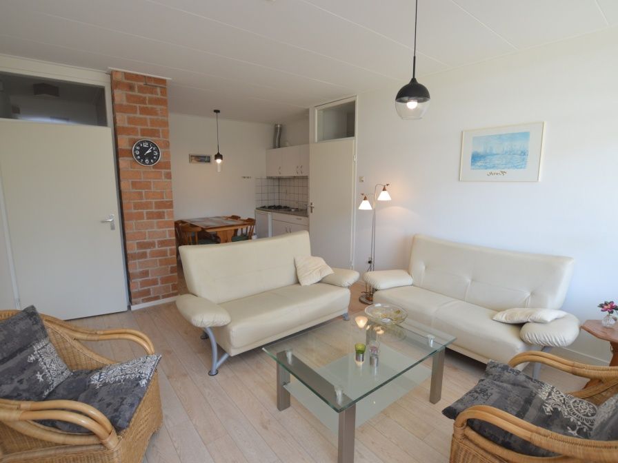 Cozy sitting area in Apartment Kerckeland 80 in De Koog on Texel, Wadden Islands, with comfortable sofas.