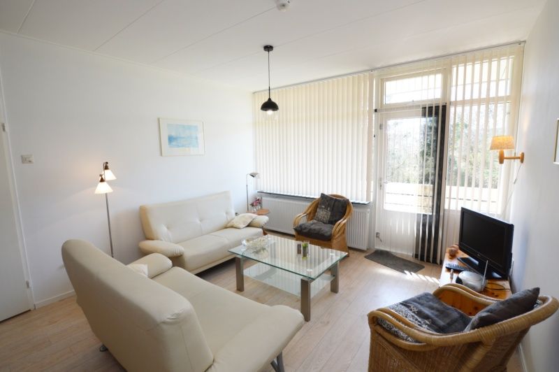 Stylish interior of Apartment Kerckeland 80, De Koog, Texel, with modern interior and views of nature.