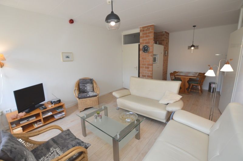 Spacious living room with television in Apartment Kerckeland 80, De Koog, Texel, perfect for cozy evenings.