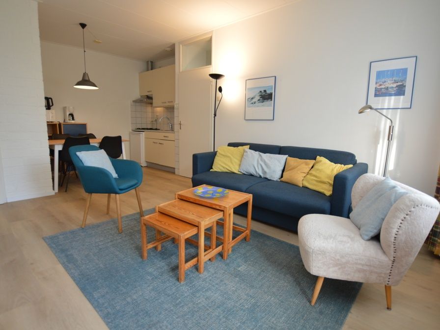 Cozy living room in Apartment Kerckeland 126, De Koog, Texel, with comfortable seating area and modern furnishings.
