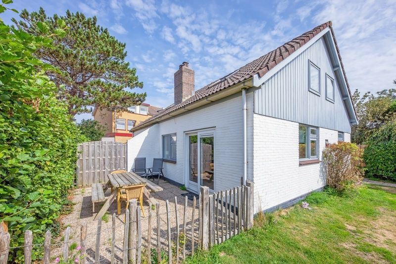 Spacious terrace at 32a Castor vacation home in De Koog, Texel, ideal for outdoor breakfasts.