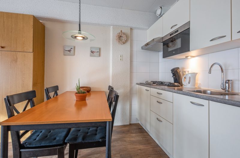Practical kitchen and dining area in Motel Texel Apartment with Bath (B), De Koog, Texel for cozy meals.