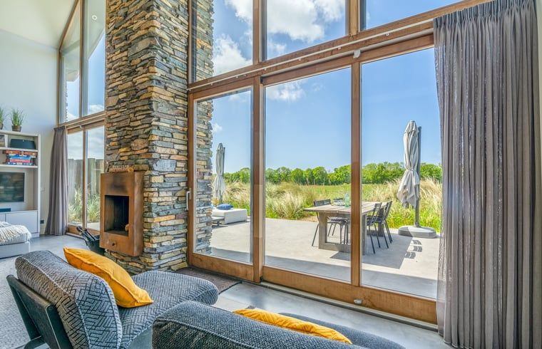 Large window overlooking terrace in Holiday cottage in De Koog, Texel.