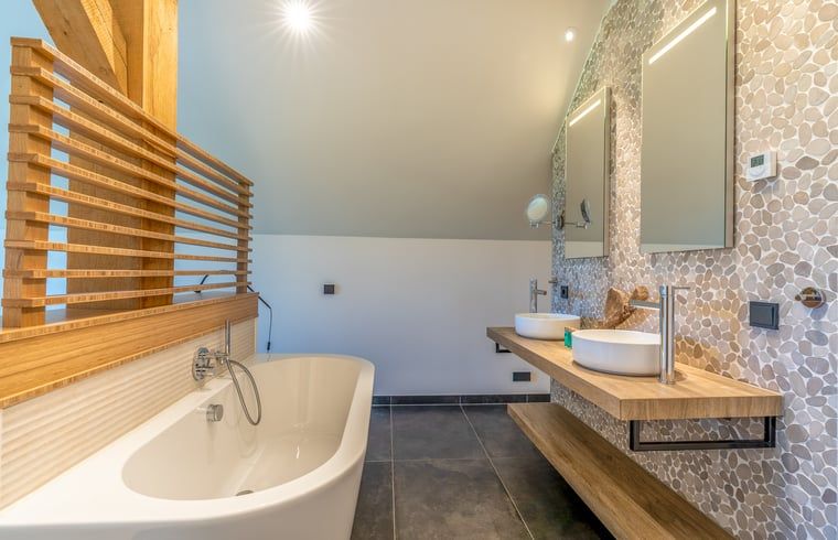 Luxury bathroom with bathtub in Holiday home in De Koog, Texel, Wadden Islands.