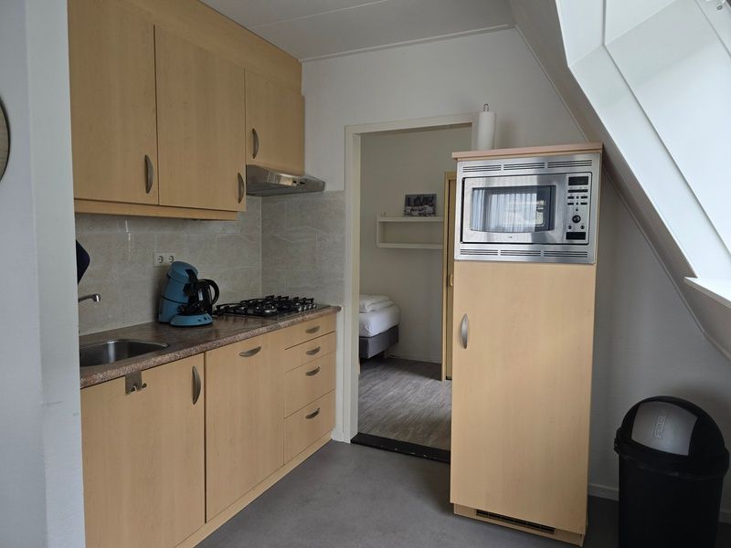 Voll ausgestattete Kueche in Apartments Anna - Apartment 15 in De Koog, Texel, mit modernen Geraeten.