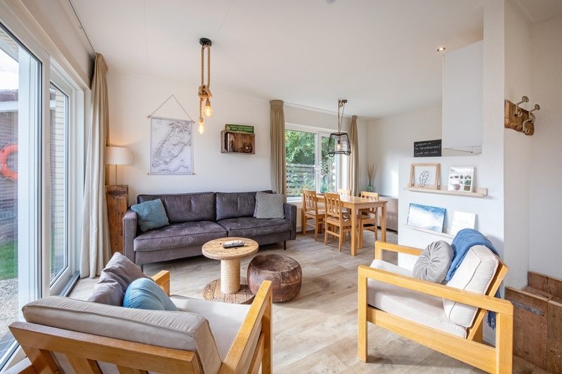 Bright living room in De Strandvondst vacation home, De Koog, Texel with comfortable seating area.