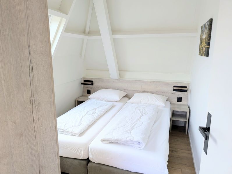 Cozy bedroom with two beds in Two persons apartment large - second floor, De Koog, Texel.