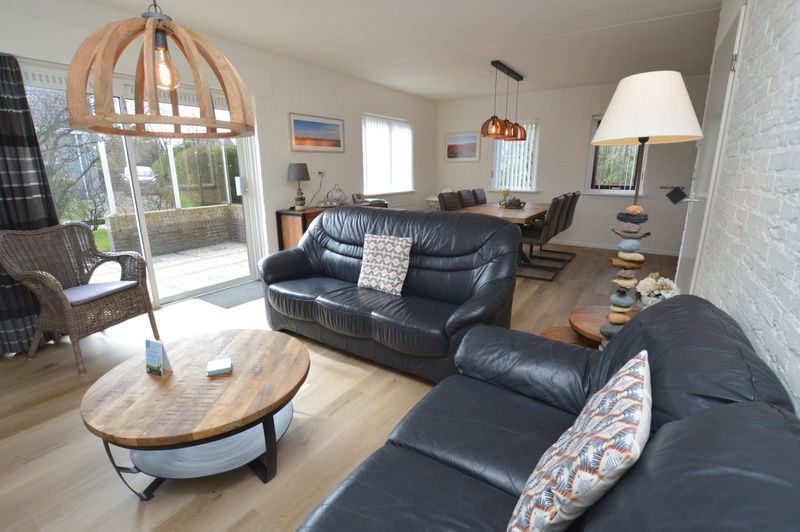 Vacation home Stappeland 205 in De Koog, Texel offers an open living space with stylish furniture and a cozy atmosphere.