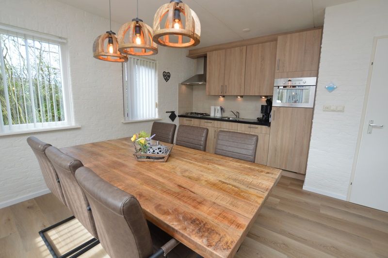 Modern kitchen and dining area in Holiday home Stappeland 205, De Koog, Texel with all the comforts of home.
