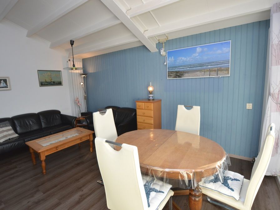 Stylish living room in Motel Texel - Apartment 315/1T, De Koog, Texel with cozy sitting area and maritime decorations.